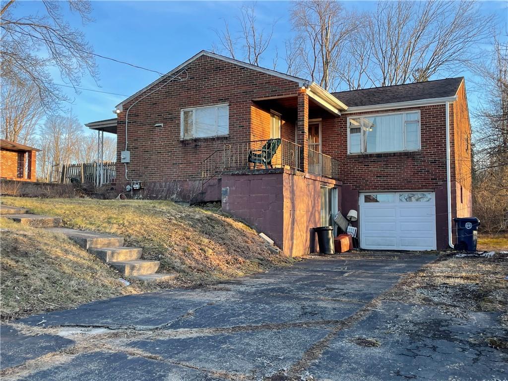 104 Colbaugh Drive Trafford, PA 15085 - Photo 1 of 16 a view of a house with a yard