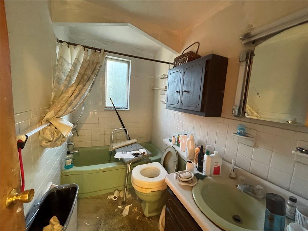 104 Colbaugh Drive Trafford, PA 15085 - Photo 14 of 16 a bathroom with a sink toilet and mirror