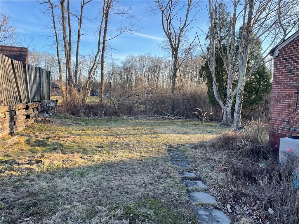 104 Colbaugh Drive Trafford, PA 15085 - Photo 3 of 16 a view of a backyard with large trees
