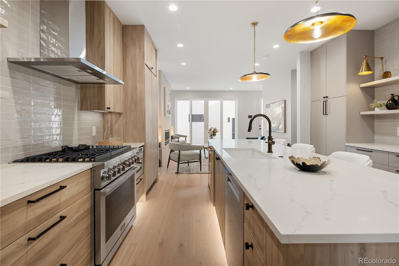 4572 North Raleigh Street Denver, CO 80212 - Photo 11 of 50 a kitchen with stainless steel appliances granite countertop a stove a sink and a refrigerator