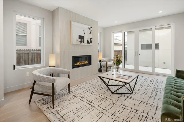 a living room with furniture and a rug