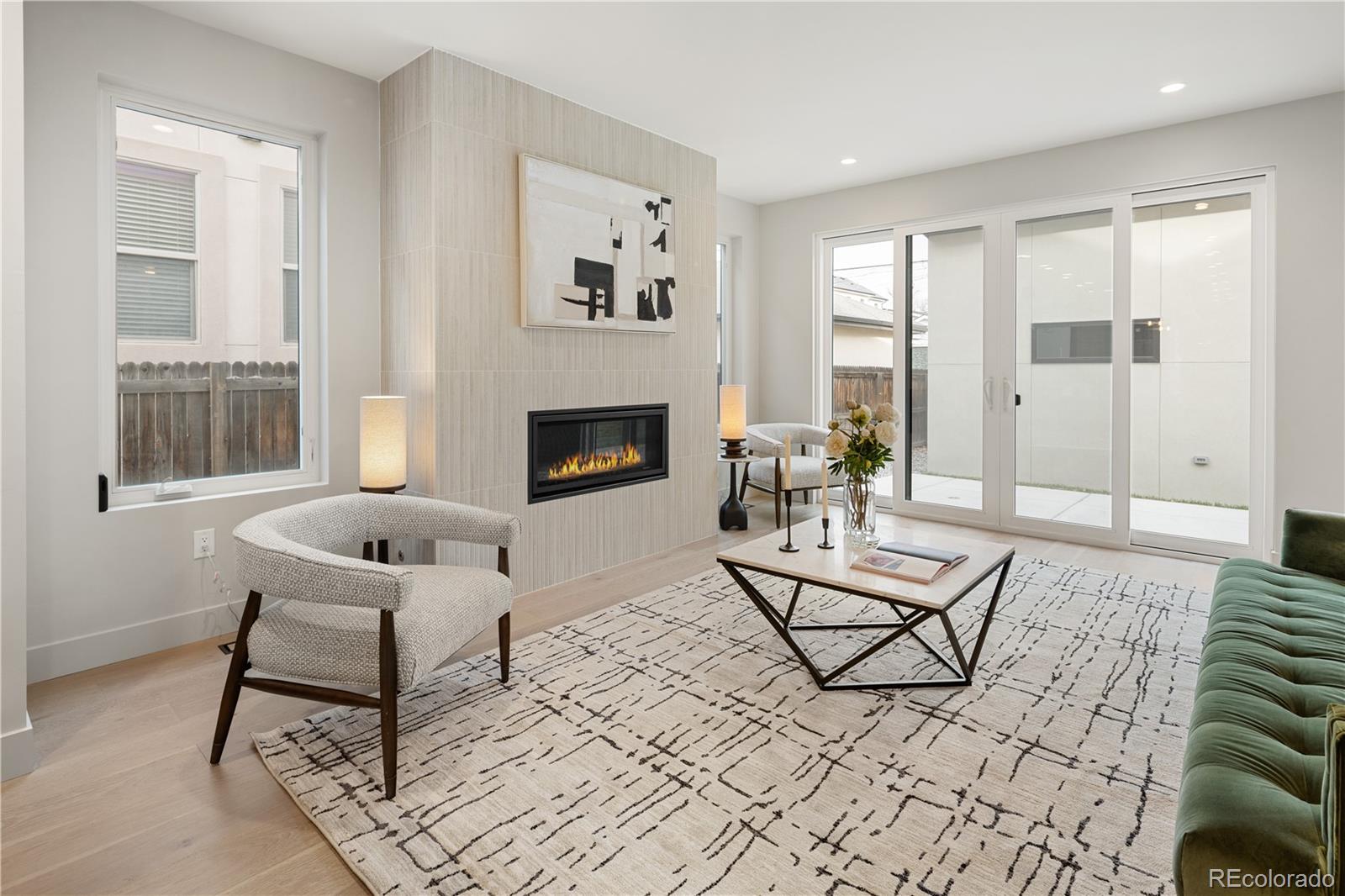 4572 North Raleigh Street Denver, CO 80212 - Photo 12 of 50 a living room with furniture and a fireplace