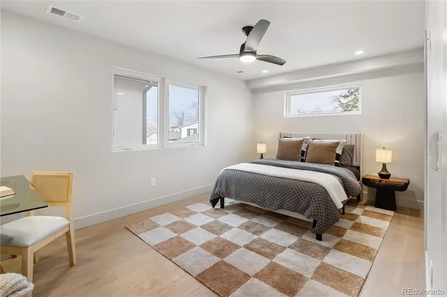 a bedroom with a bed and a chair