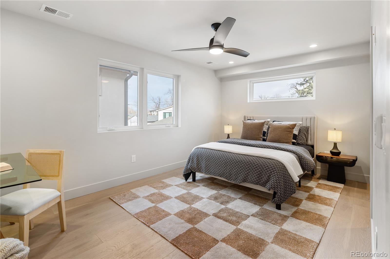 4572 North Raleigh Street Denver, CO 80212 - Photo 21 of 50 a bedroom with a bed and a chair