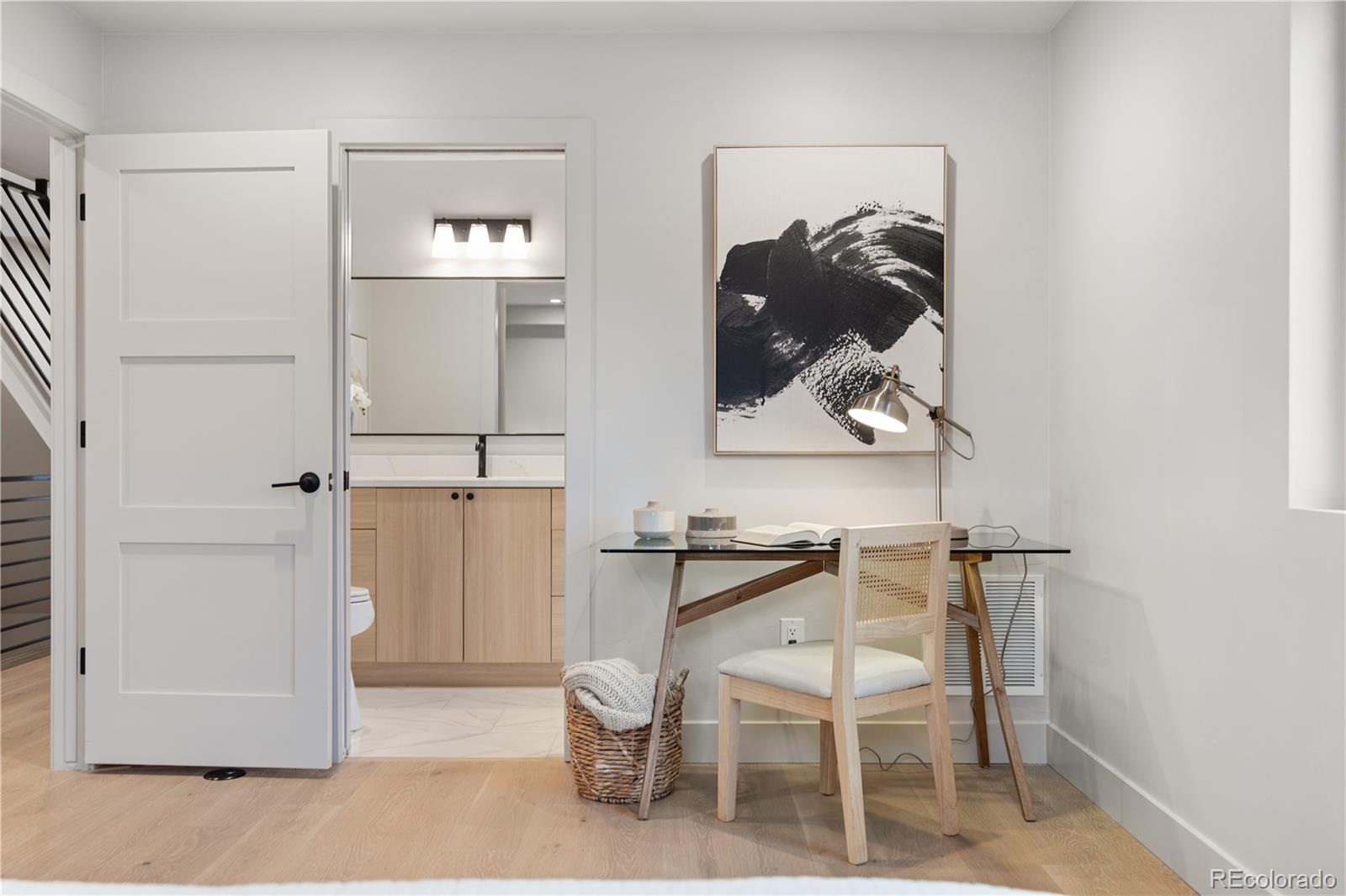 4572 North Raleigh Street Denver, CO 80212 - Photo 23 of 50 a view of a hallway with wooden floor and chair