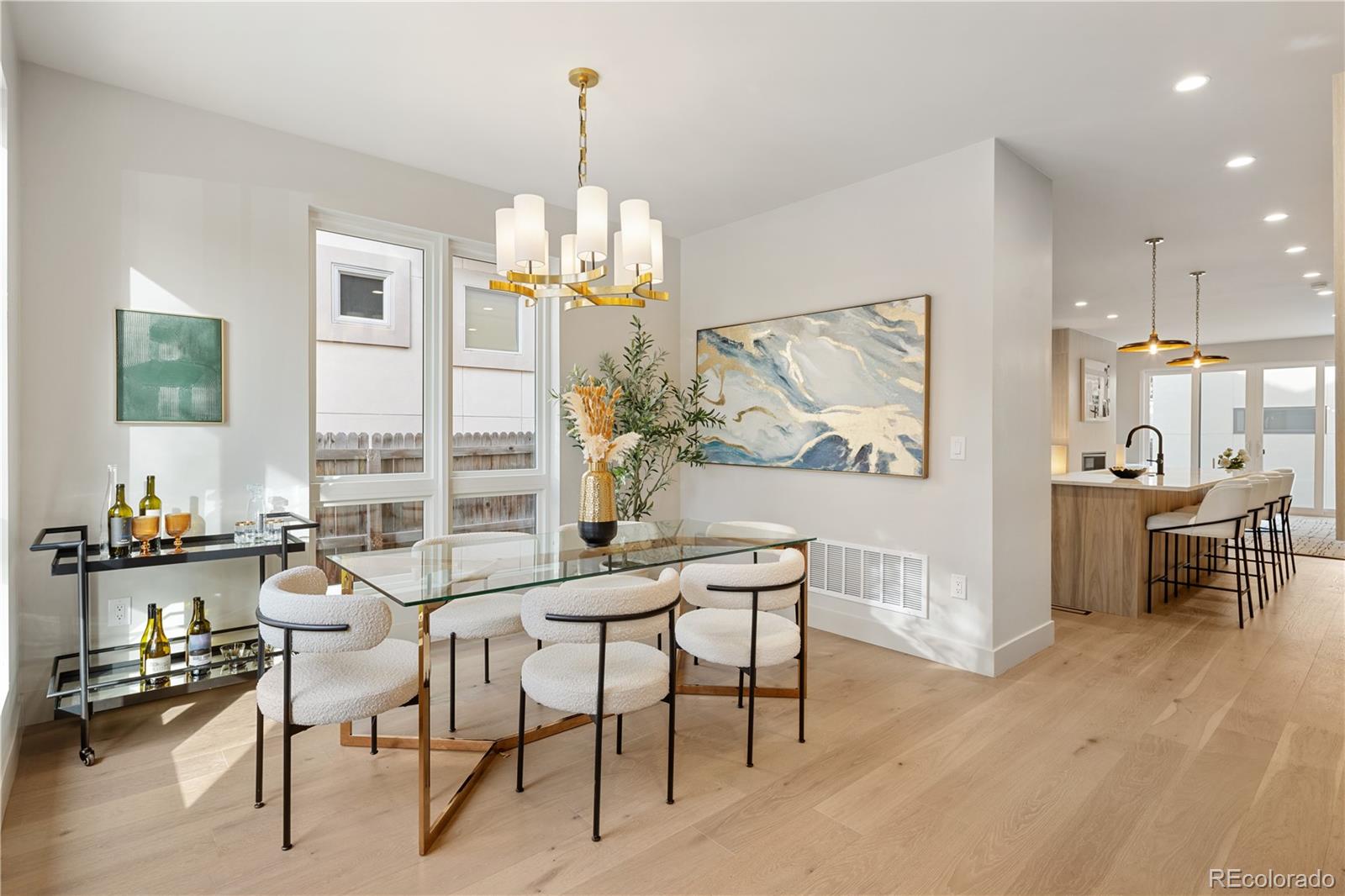 4572 North Raleigh Street Denver, CO 80212 - Photo 3 of 50 a dining room with furniture a chandelier and wooden floor