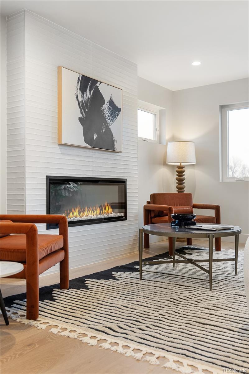 4572 North Raleigh Street Denver, CO 80212 - Photo 32 of 50 a living room with furniture and a fireplace