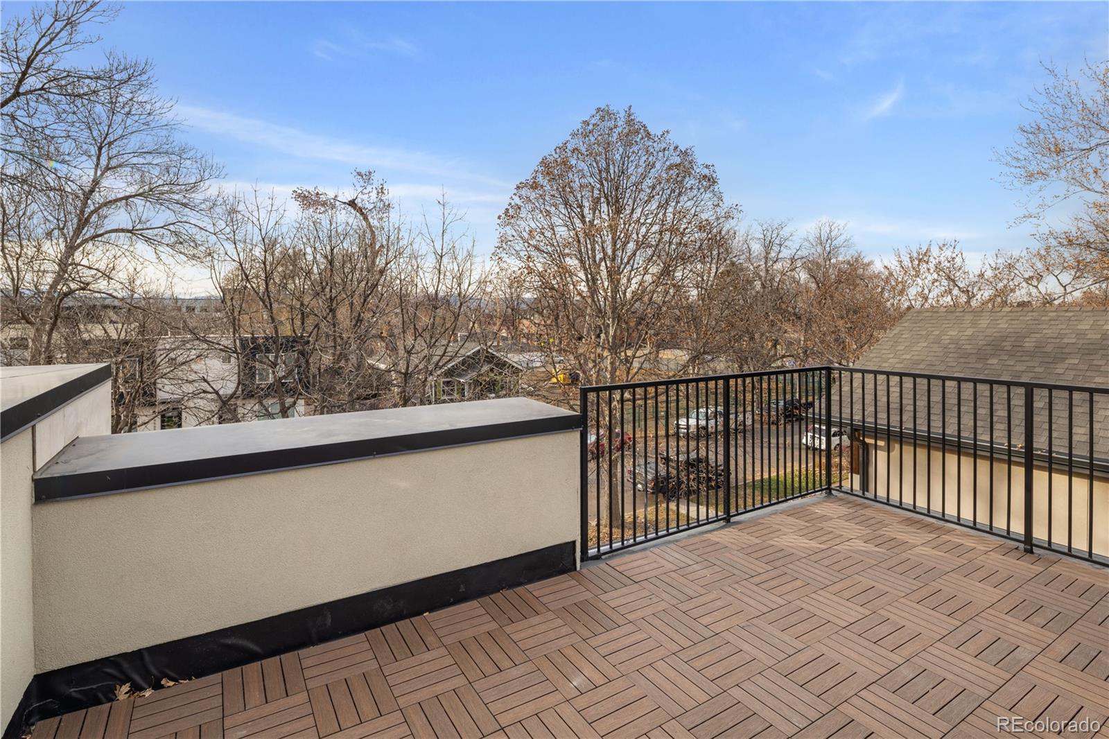 4572 North Raleigh Street Denver, CO 80212 - Photo 35 of 50 a view of a balcony with trees
