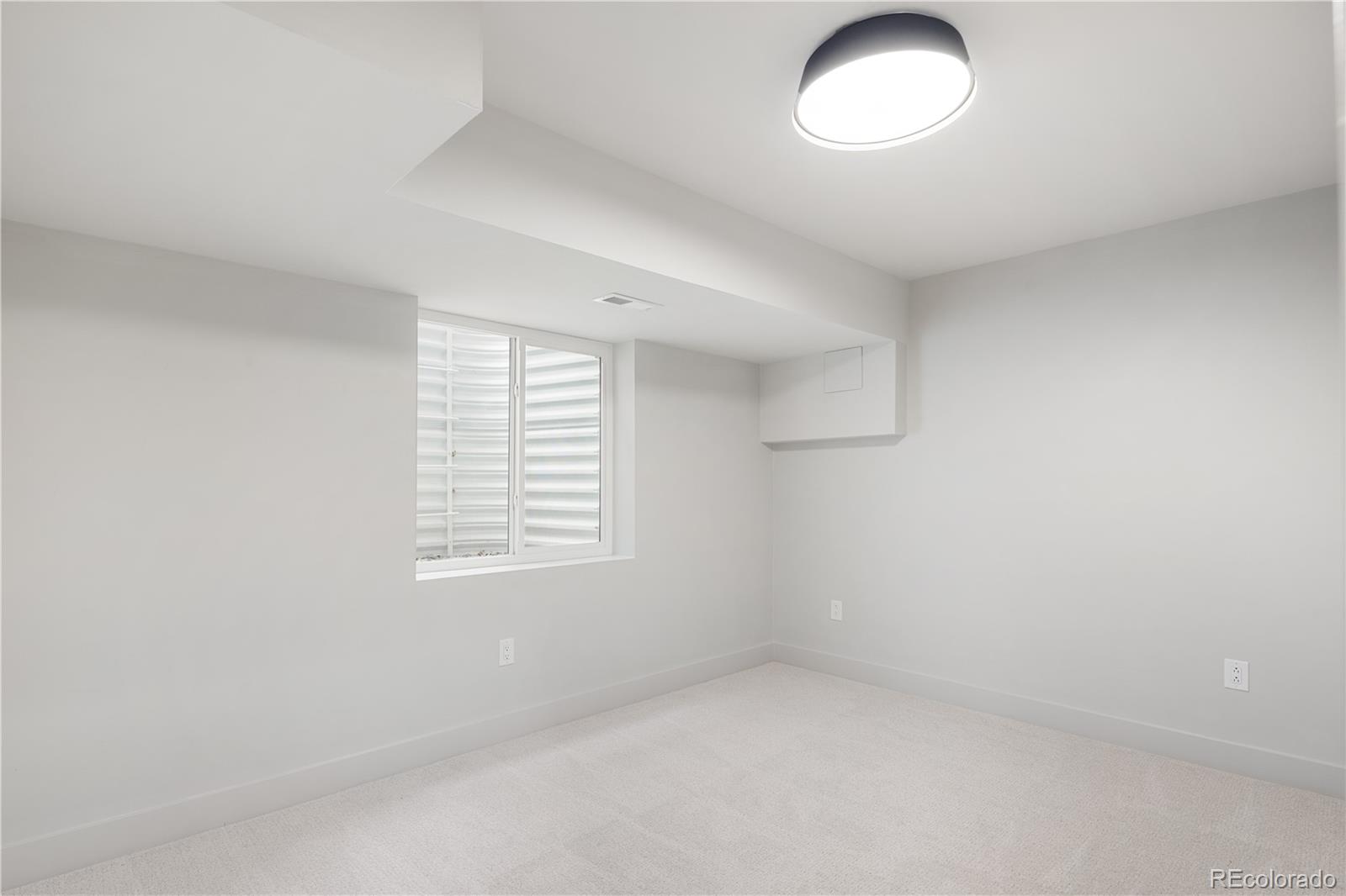 4572 North Raleigh Street Denver, CO 80212 - Photo 40 of 50 an empty room with a window