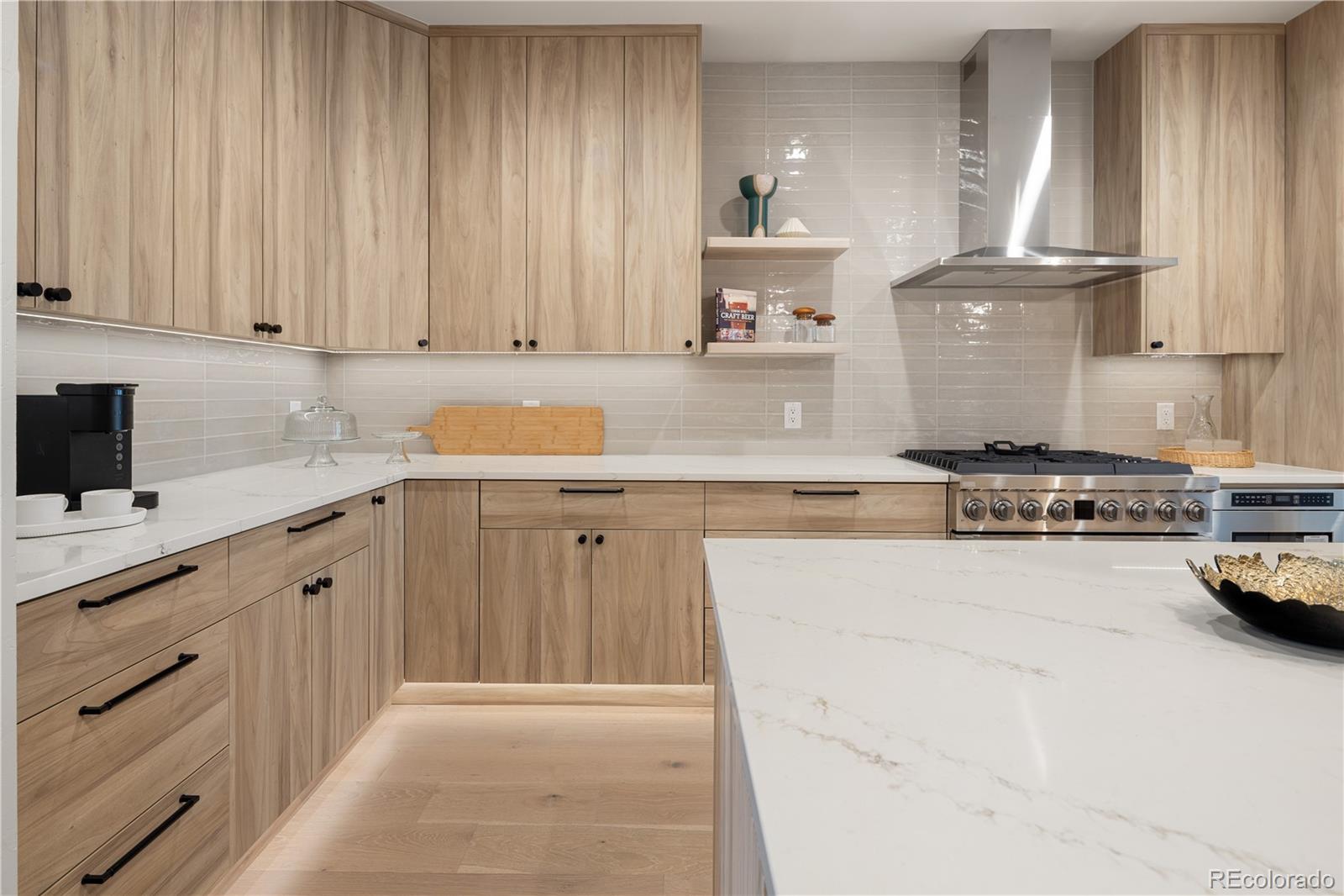 4572 North Raleigh Street Denver, CO 80212 - Photo 6 of 50 a kitchen with kitchen island granite countertop a sink stainless steel appliances and cabinets
