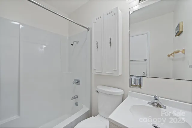 a bedroom with a bed and a lamp on table