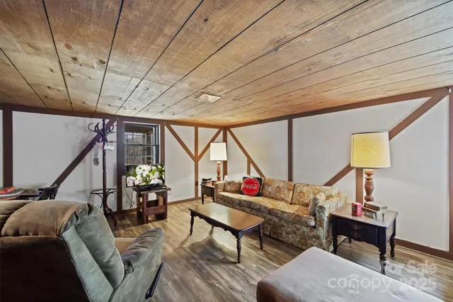 a view of a chairs and table in the balcony