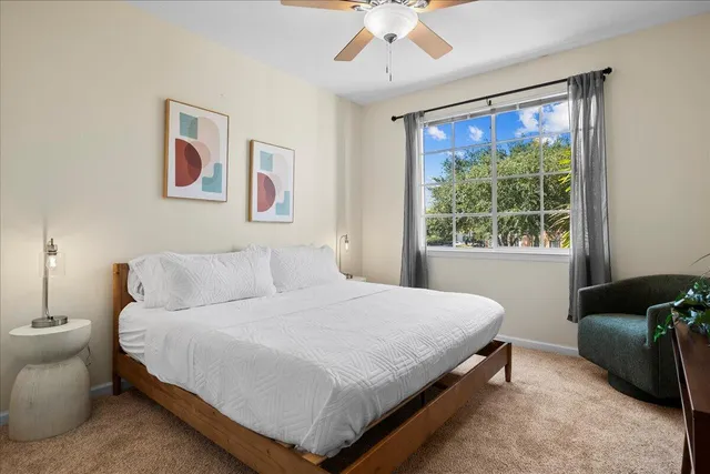 a bedroom with a bed and window