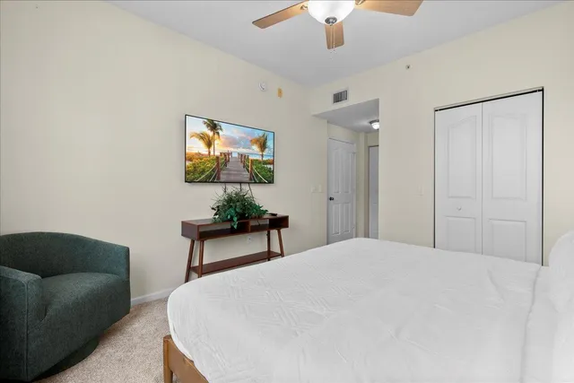 a bedroom with furniture and a chandelier