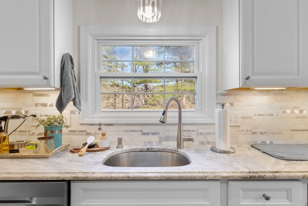 38 Brook Street Georgetown, MA 01833 - Photo 9 of 42 a kitchen with granite countertop a sink and a window