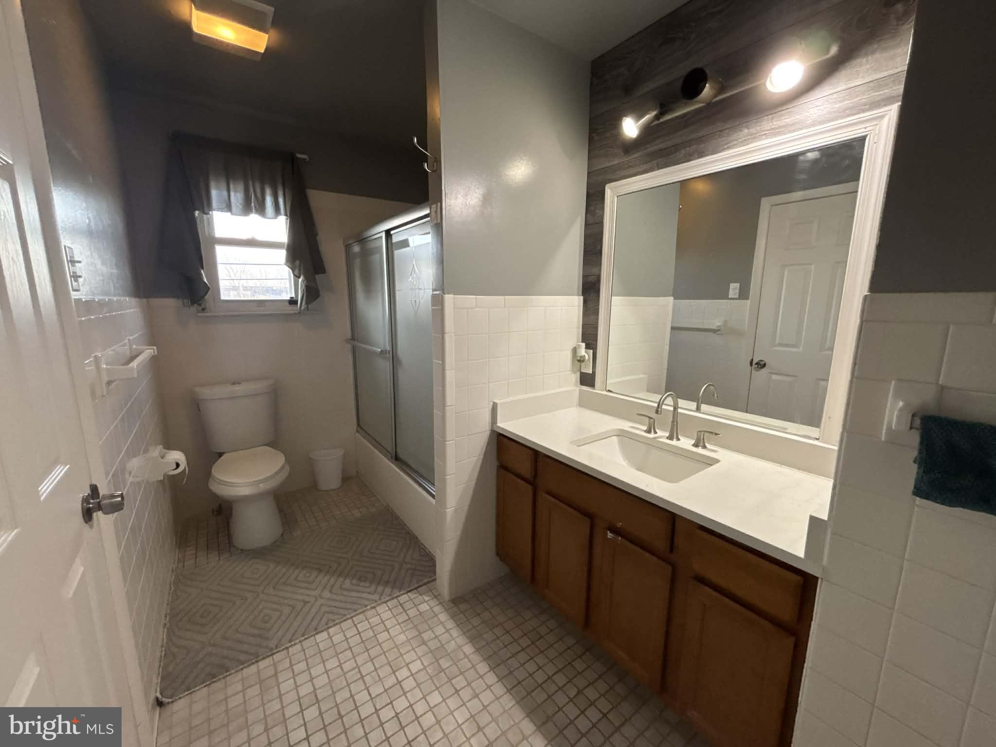 809 Bacon Avenue Dover, DE 19901 - Photo 13 of 27 a bathroom with a double vanity sink toilet and shower