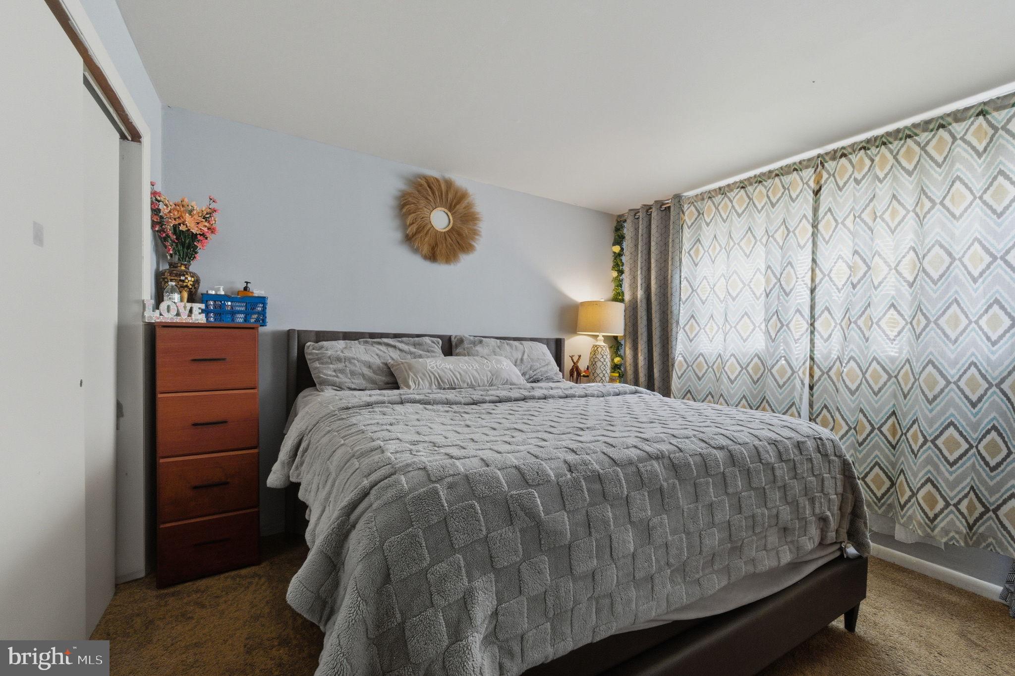 809 Bacon Avenue Dover, DE 19901 - Photo 18 of 27 a bedroom with a bed and a window