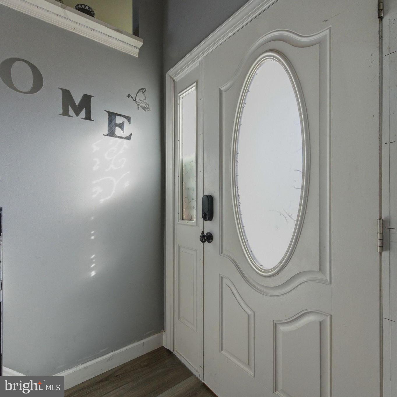 809 Bacon Avenue Dover, DE 19901 - Photo 19 of 27 a view of a hallway with wooden floor and a sink