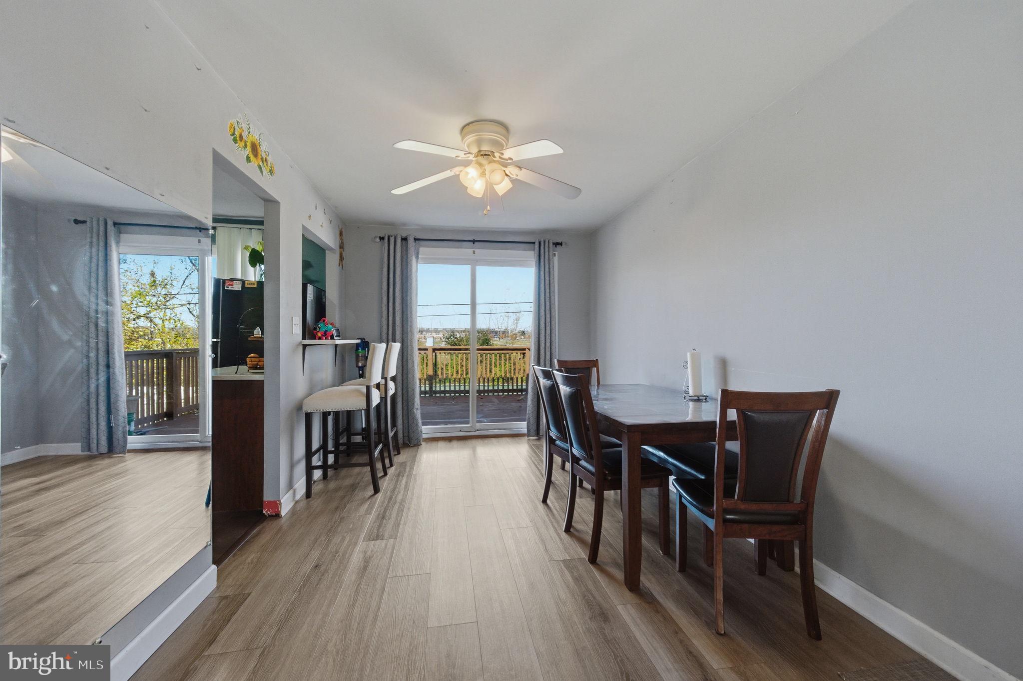 809 Bacon Avenue Dover, DE 19901 - Photo 5 of 27 a view of a dining room with furniture and wooden floor