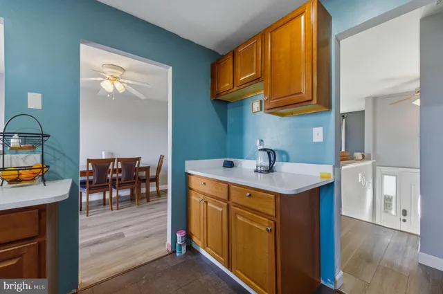 a utility room with mirror and a sink