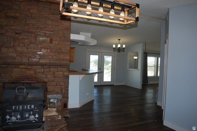1055 West Ashby Road Delta, UT 84624 - Photo 6 of 44 Stacked stone fireplace with a wood-burning insert