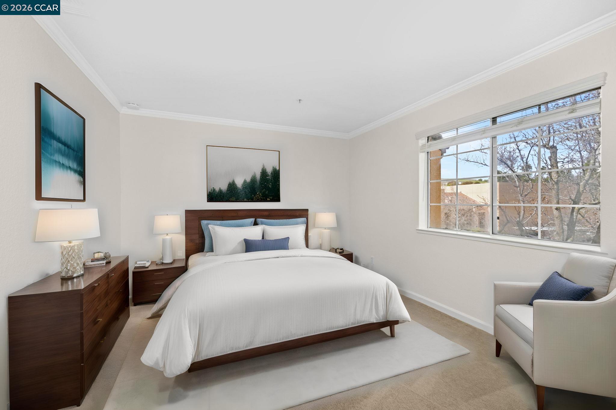 440 Bollinger Canyon Lane, Unit 396 San Ramon, CA 94582 - Photo 15 of 24 a bedroom with a bed and glass window