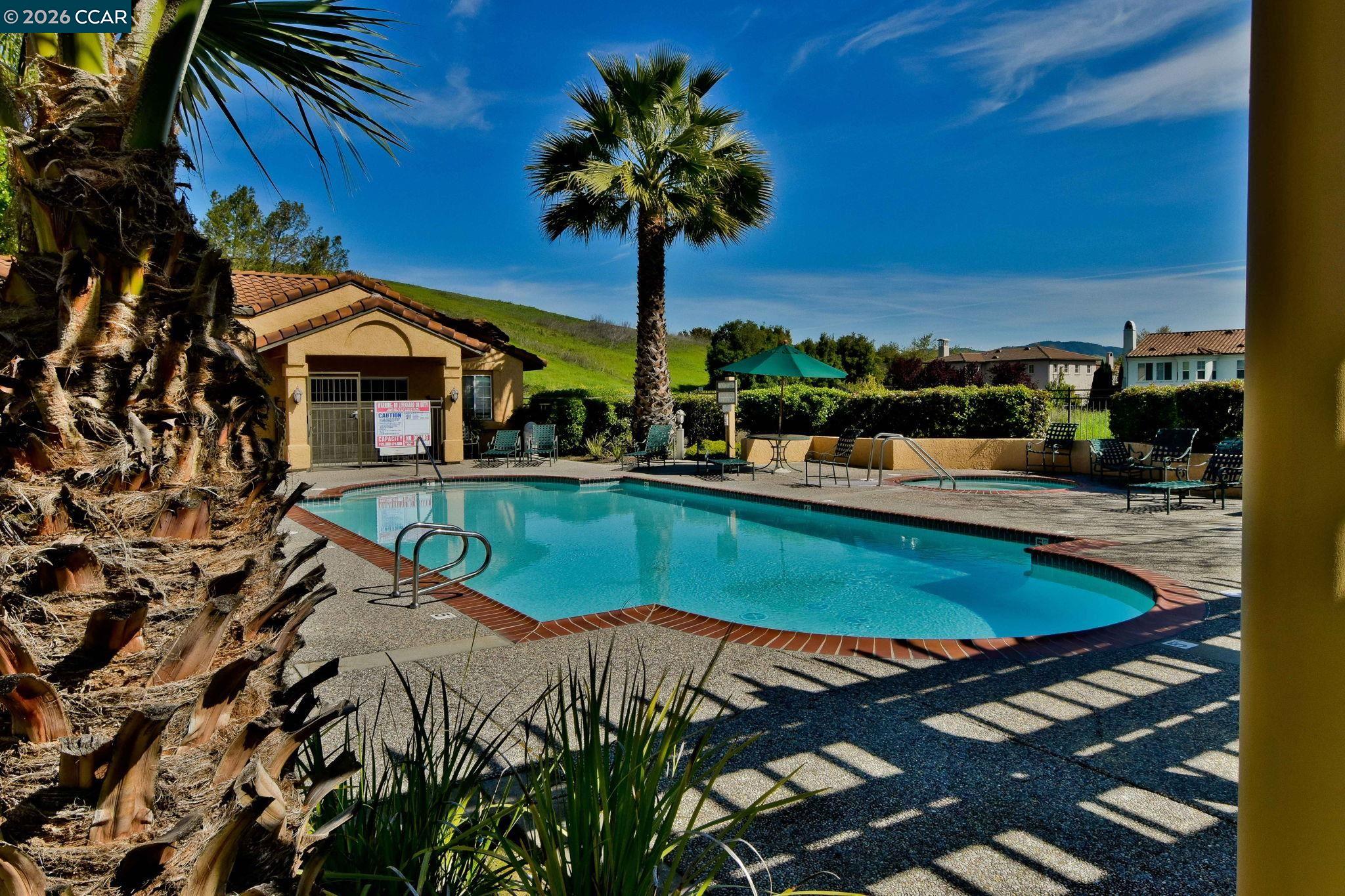 440 Bollinger Canyon Lane, Unit 396 San Ramon, CA 94582 - Photo 19 of 24 swimming pool view with a seating space and a garden