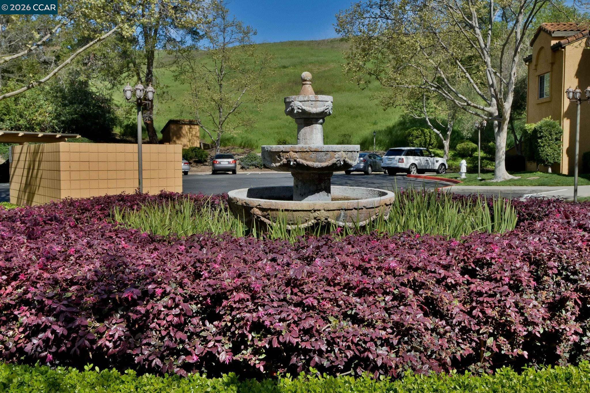 440 Bollinger Canyon Lane, Unit 396 San Ramon, CA 94582 - Photo 21 of 24 a view of a chair and table in the garden