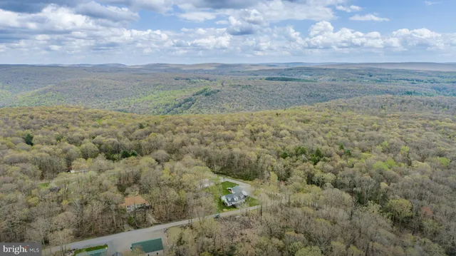 a view of a yard with an ocean