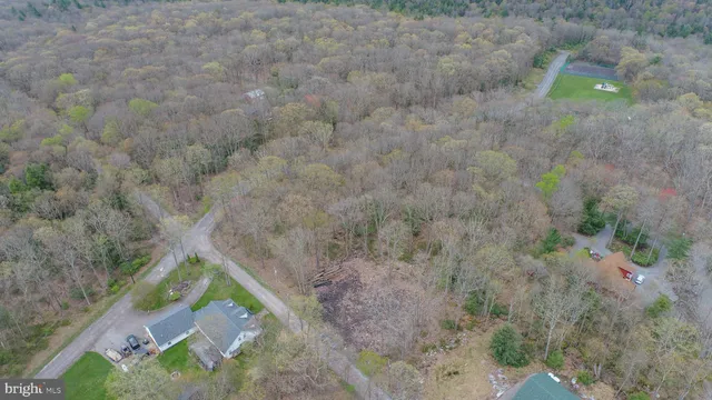 a aerial view of a house with a yard
