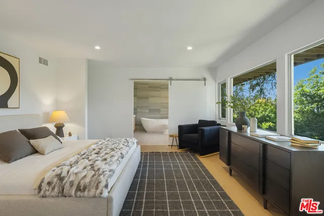 a bathroom with a toilet sink and shower