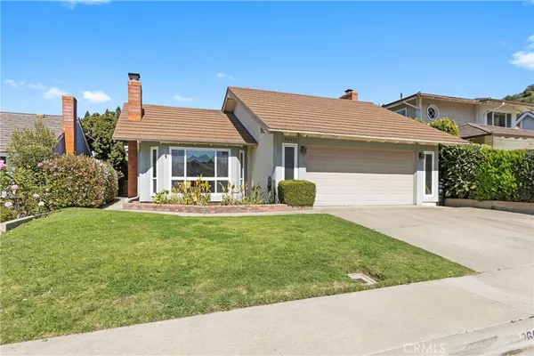a view of a house with backyard porch and garden