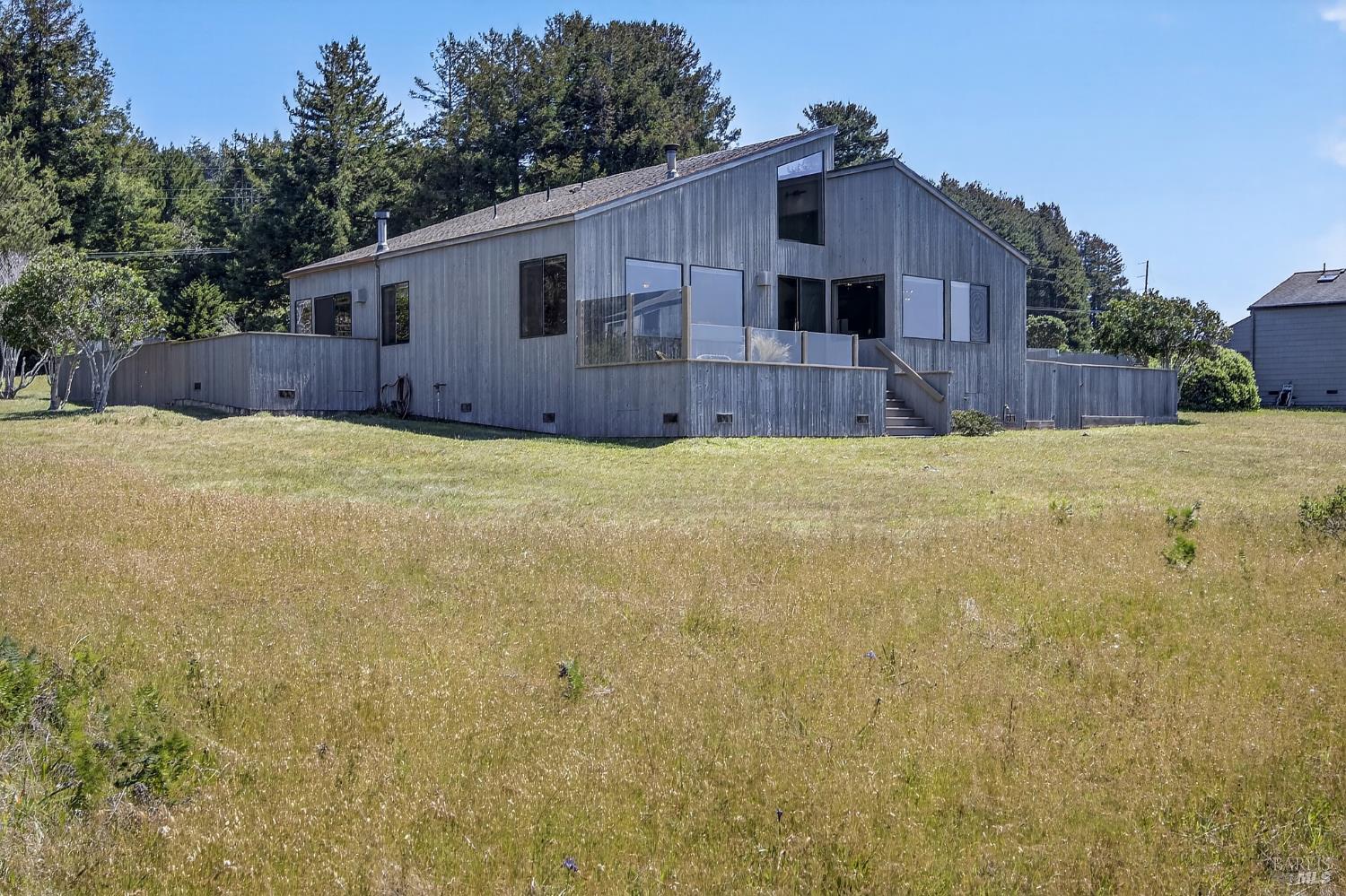41339 Westwind The Sea Ranch, CA 95497 - Photo 48 of 60 Back of house showing deck with hot tub from primary bedroom and back deck from living room