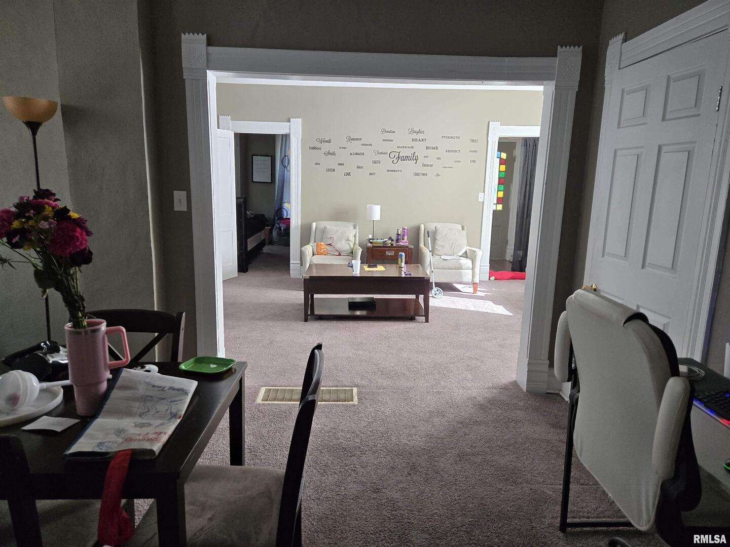 408 North Springer Street, Unit 2 Carbondale, IL 62901 - Photo 4 of 15 a dining room with furniture and a potted plant