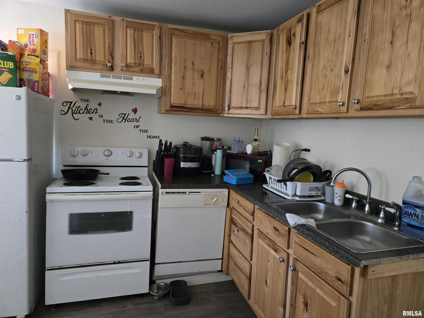 408 North Springer Street, Unit 2 Carbondale, IL 62901 - Photo 7 of 15 a kitchen with stainless steel appliances granite countertop a sink stove refrigerator and cabinets