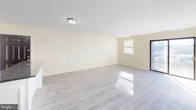 a view of an empty room and window