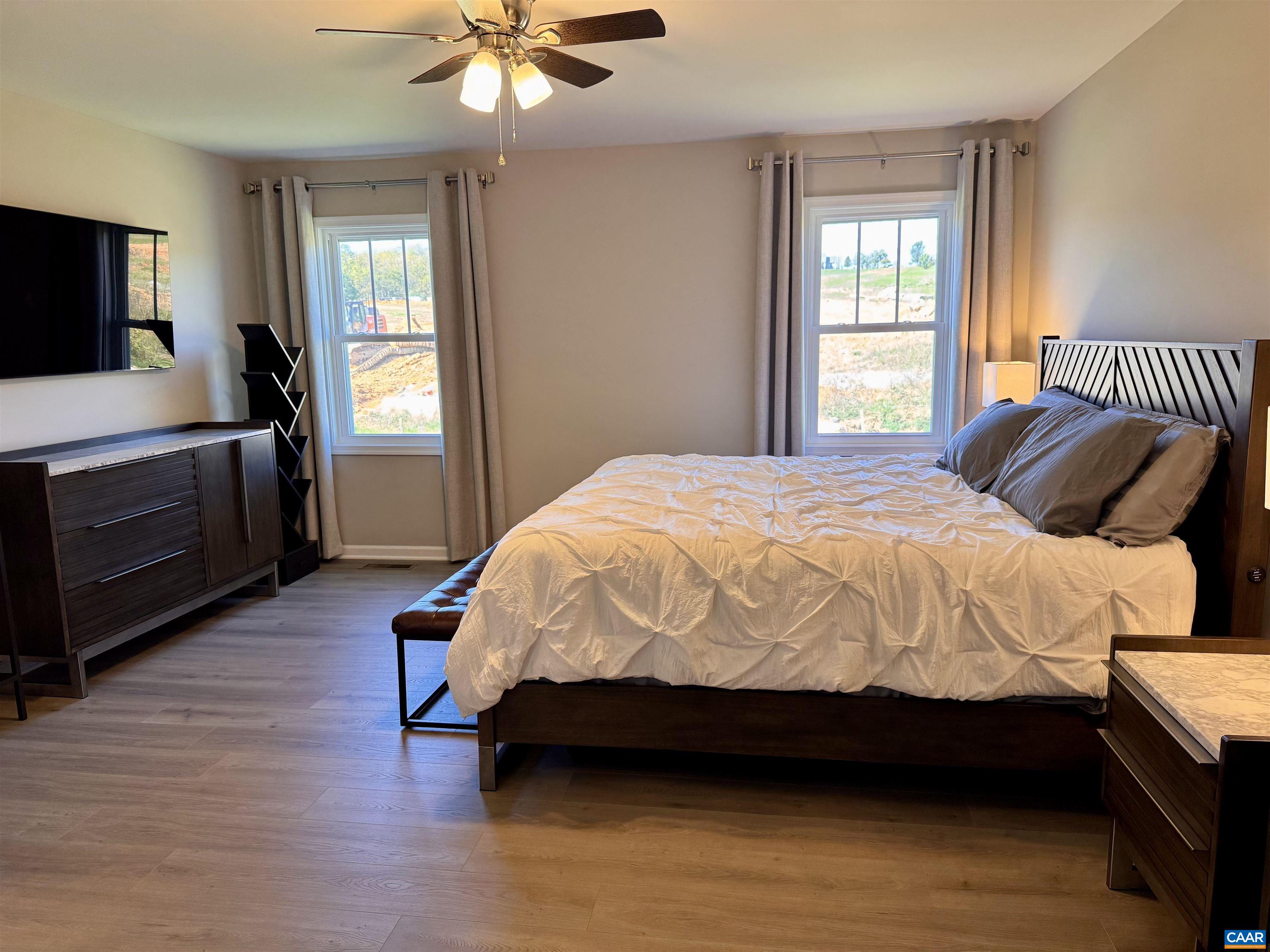 201 Spring Run Lane Waynesboro, VA 22980 - Photo 17 of 29 a bedroom with a bed and a chandelier