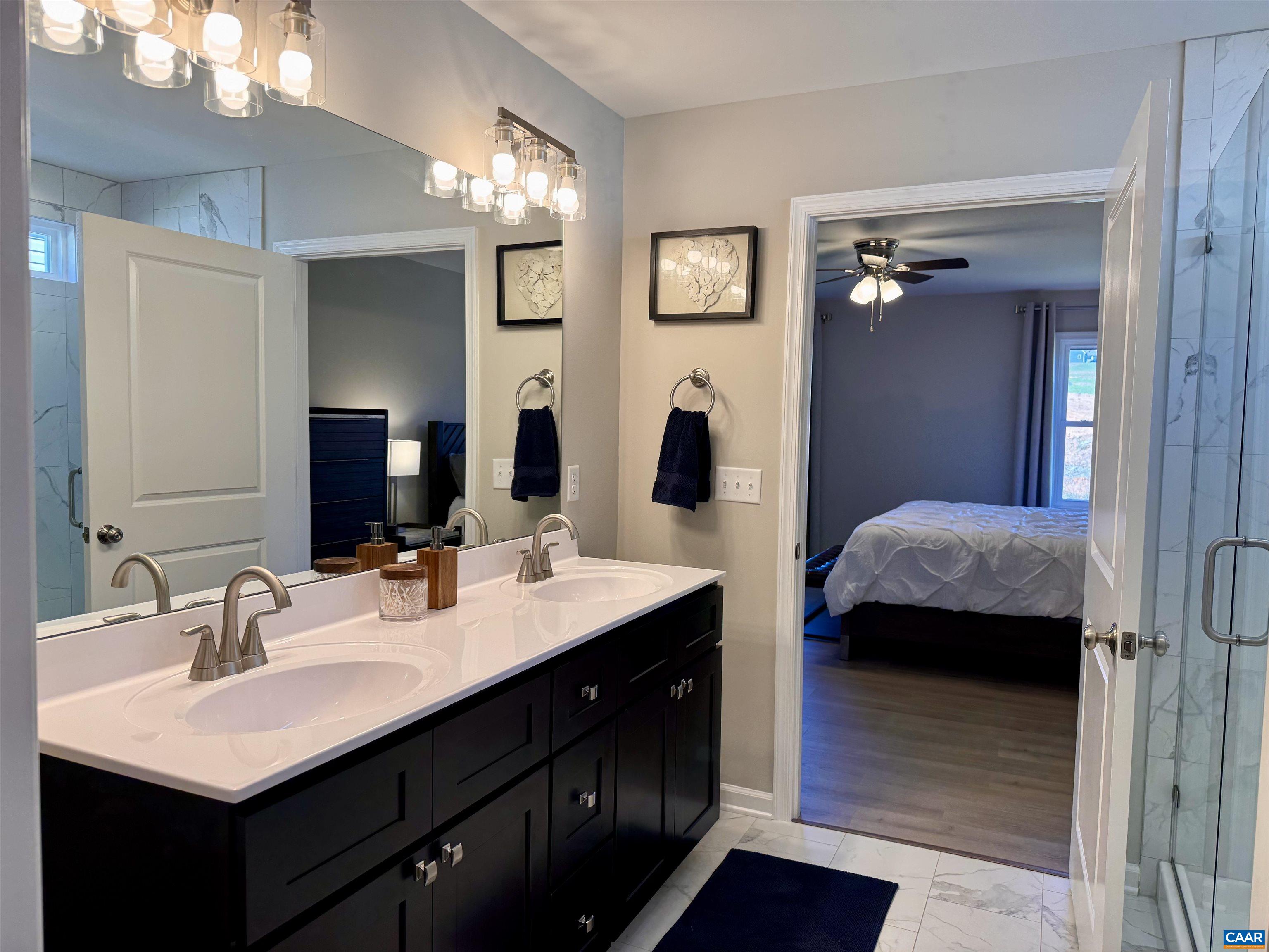 201 Spring Run Lane Waynesboro, VA 22980 - Photo 19 of 29 a en suite bathroom with double vanity and a mirror