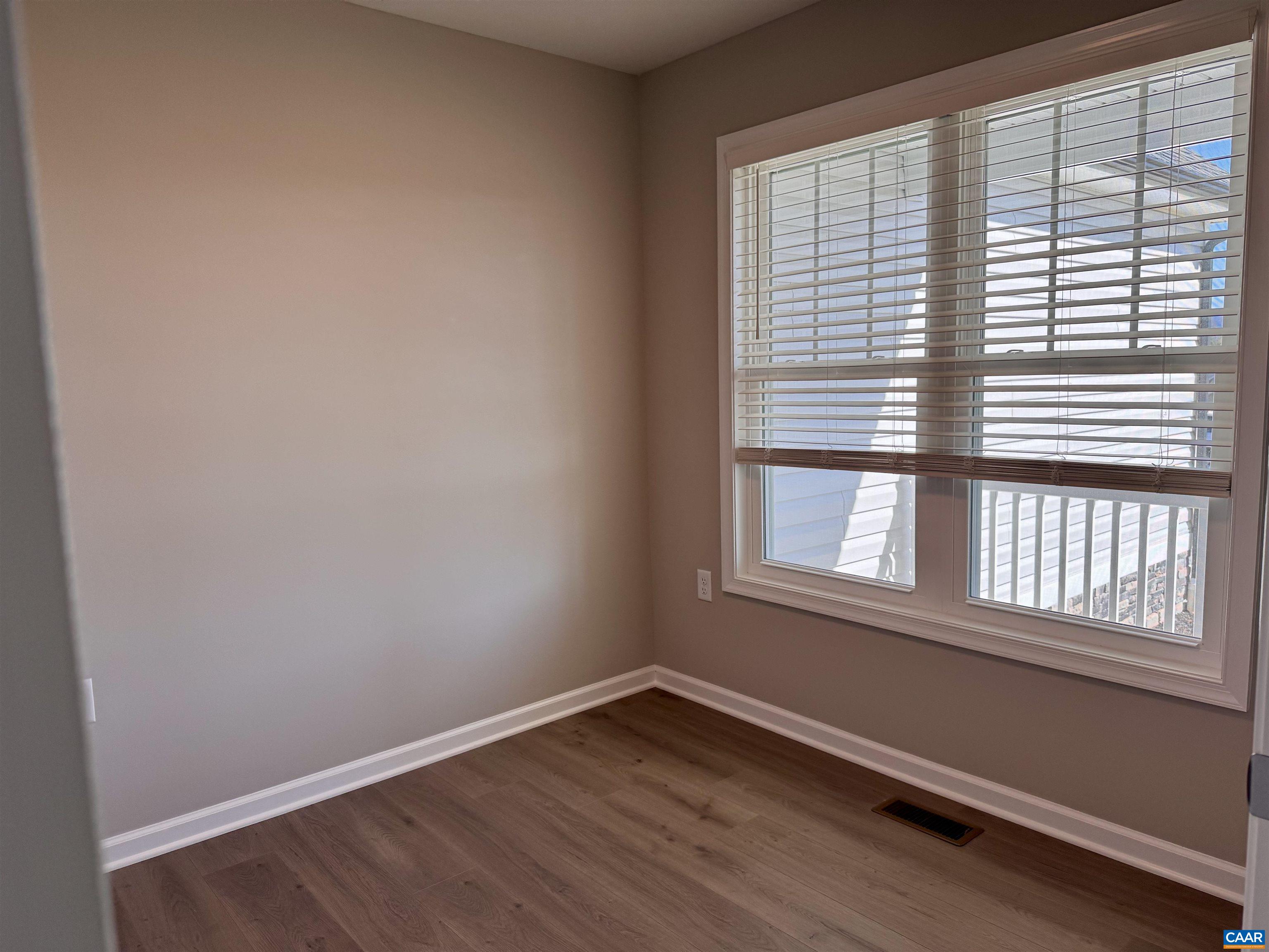 201 Spring Run Lane Waynesboro, VA 22980 - Photo 24 of 29 an empty room with wooden floor and windows