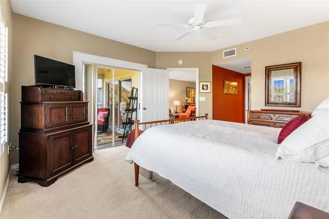 a bed room with a bed and a television