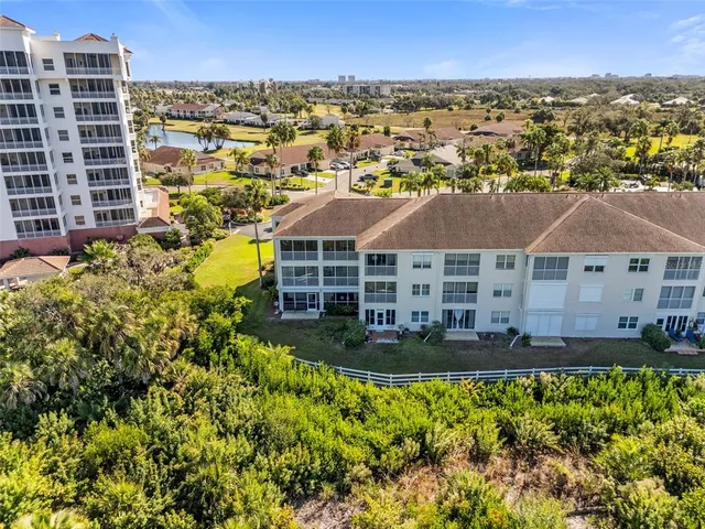 a front view of a building with garden