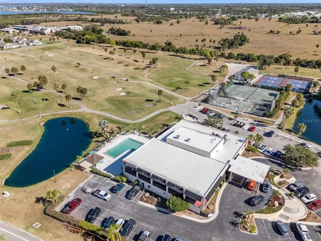 an aerial view of a residential houses with outdoor space