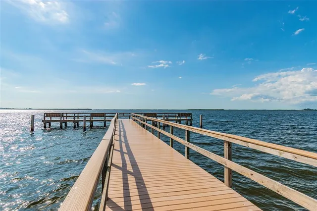 a view of a terrace with wooden floor and city view