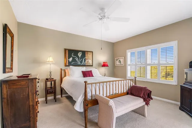 a bedroom with a bed and a table in it