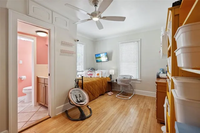a bathroom with a sink a toilet and shower curtain