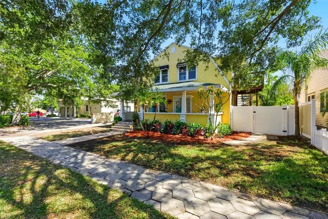 a living room with furniture a window and wooden floor