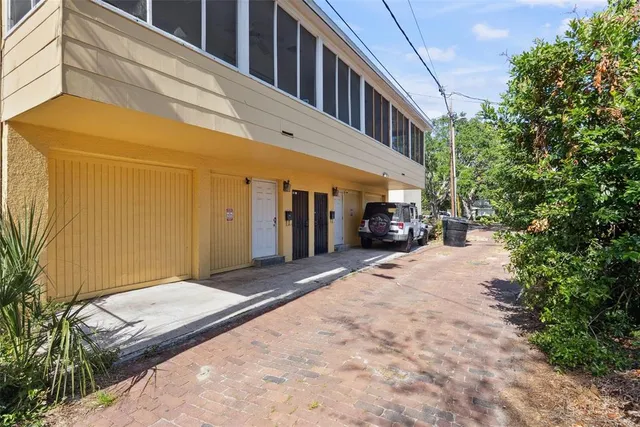 a balcony with furniture and a large window
