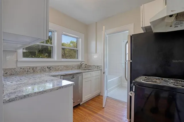 a bathroom with a sink a toilet and bathtub