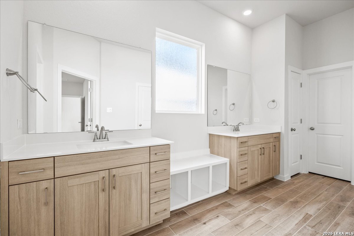 142 Stream Street Seguin, TX 78155 - Photo 11 of 20 a spacious bathroom with a double vanity sink a mirror and a
