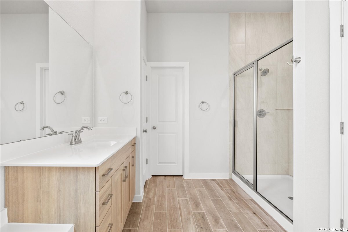 142 Stream Street Seguin, TX 78155 - Photo 12 of 20 a bathroom with a sink and a mirror